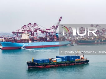 The Maersk Halifax, on the Central and South America route, berths at the Qianwan Container Terminal of Qingdao Port in Qingdao, Shandong Pr...