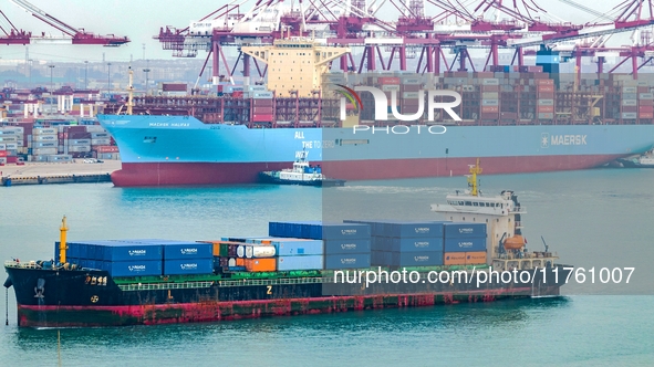 The Maersk Halifax, on the Central and South America route, berths at the Qianwan Container Terminal of Qingdao Port in Qingdao, Shandong Pr...