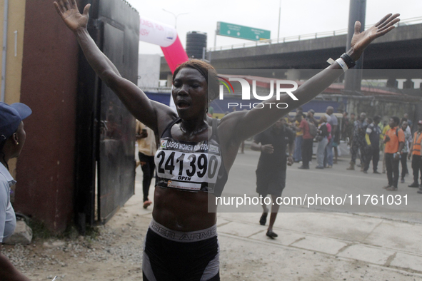 Joy Abiye David, the champion of the Lagos Women Run 2024, with an impressive time of 39:35:21, celebrates during the ninth edition of the L...