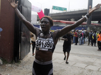 Joy Abiye David, the champion of the Lagos Women Run 2024, with an impressive time of 39:35:21, celebrates during the ninth edition of the L...