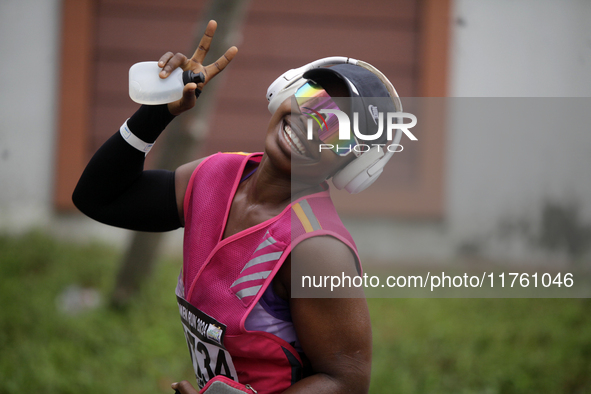 A woman shows excitement during the ninth edition of the Lagos Women Run 2024, a 10km female road race, tagged ''More Than a Run,'' held at...