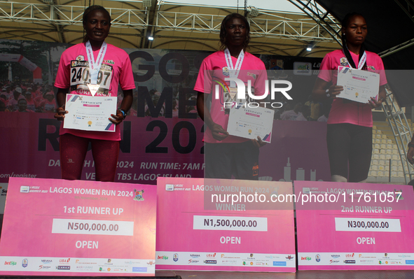 From left to right: Liliane Nguetsa of Cameroon, second place at the Lagos Women Run 2024, with a time of 40:02:54; Joy Abiye David, the cha...