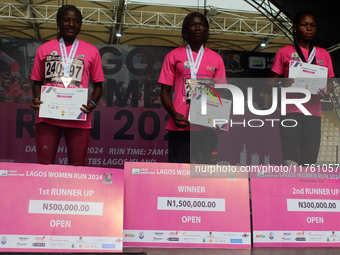 From left to right: Liliane Nguetsa of Cameroon, second place at the Lagos Women Run 2024, with a time of 40:02:54; Joy Abiye David, the cha...