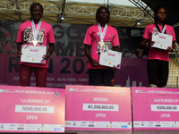 From left to right: Liliane Nguetsa of Cameroon, second place at the Lagos Women Run 2024, with a time of 40:02:54; Joy Abiye David, the cha...