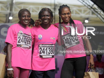 From left to right: Liliane Nguetsa of Cameroon, second place at the Lagos Women Run 2024, with a time of 40:02:54; Joy Abiye David, the cha...