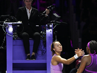 RIYADH, SAUDI ARABIA - NOVEMBER 09: Quinwen Zheng of China congratulates Coco Gauff of USA after she wins the Final match, on Day 8 of the 2...