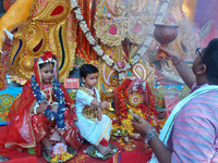 Indian children dressed as Lord Durga and Lord Shiva are worshiped during the rituals of Jagaddhatri Puja in Siliguri, India, on November 10...