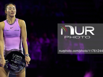 RIYADH, SAUDI ARABIA - NOVEMBER 09: Qinwen Zheng of China holds the runner-up trophy after losing to Coco Gauff of the United States in the...