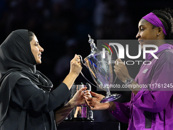 RIYADH, SAUDI ARABIA - NOVEMBER 09: Coco Gauff of the United States is presented the Billie Jean King Trophy after defeating Qinwen Zheng of...