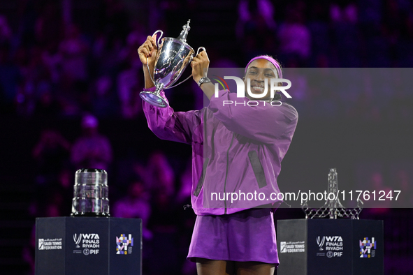 RIYADH, SAUDI ARABIA - NOVEMBER 09: Coco Gauff of the United States poses with the Billie Jean King Trophy after defeating Qinwen Zheng of C...