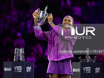 RIYADH, SAUDI ARABIA - NOVEMBER 09: Coco Gauff of the United States poses with the Billie Jean King Trophy after defeating Qinwen Zheng of C...