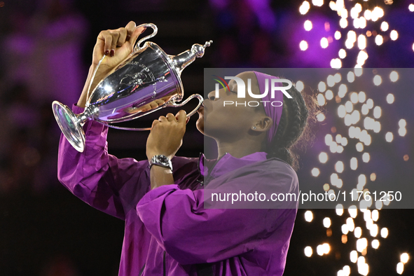 RIYADH, SAUDI ARABIA - NOVEMBER 09: Coco Gauff of the United States poses with the Billie Jean King Trophy after defeating Qinwen Zheng of C...