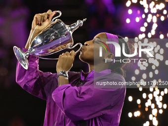 RIYADH, SAUDI ARABIA - NOVEMBER 09: Coco Gauff of the United States poses with the Billie Jean King Trophy after defeating Qinwen Zheng of C...