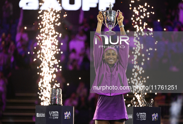 RIYADH, SAUDI ARABIA - NOVEMBER 09: Coco Gauff of the United States poses with the Billie Jean King Trophy after defeating Qinwen Zheng of C...