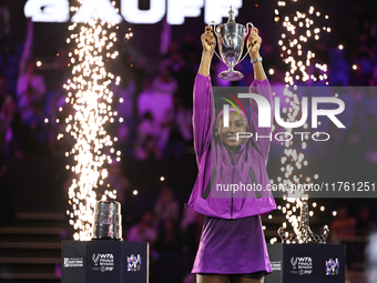 RIYADH, SAUDI ARABIA - NOVEMBER 09: Coco Gauff of the United States poses with the Billie Jean King Trophy after defeating Qinwen Zheng of C...