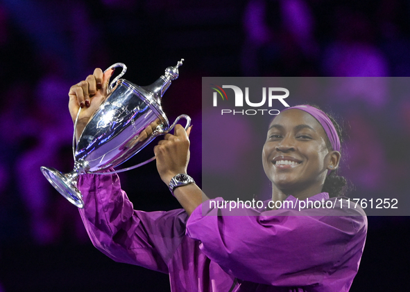 RIYADH, SAUDI ARABIA - NOVEMBER 09: Coco Gauff of the United States poses with the Billie Jean King Trophy after defeating Qinwen Zheng of C...