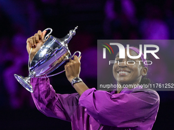 RIYADH, SAUDI ARABIA - NOVEMBER 09: Coco Gauff of the United States poses with the Billie Jean King Trophy after defeating Qinwen Zheng of C...