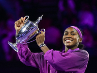 RIYADH, SAUDI ARABIA - NOVEMBER 09: Coco Gauff of the United States poses with the Billie Jean King Trophy after defeating Qinwen Zheng of C...