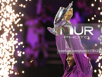 RIYADH, SAUDI ARABIA - NOVEMBER 09: Coco Gauff of the United States poses with the Billie Jean King Trophy after defeating Qinwen Zheng of C...