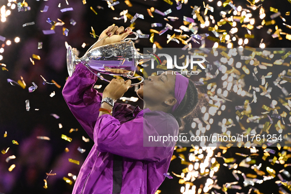 RIYADH, SAUDI ARABIA - NOVEMBER 09: Coco Gauff of the United States poses with the Billie Jean King Trophy after defeating Qinwen Zheng of C...