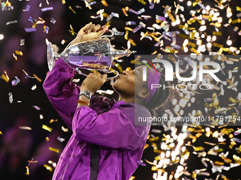 RIYADH, SAUDI ARABIA - NOVEMBER 09: Coco Gauff of the United States poses with the Billie Jean King Trophy after defeating Qinwen Zheng of C...