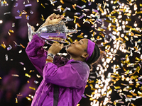 RIYADH, SAUDI ARABIA - NOVEMBER 09: Coco Gauff of the United States poses with the Billie Jean King Trophy after defeating Qinwen Zheng of C...