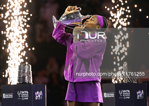 RIYADH, SAUDI ARABIA - NOVEMBER 09: Coco Gauff of the United States poses with the Billie Jean King Trophy after defeating Qinwen Zheng of C...