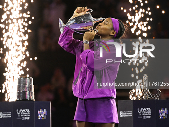 RIYADH, SAUDI ARABIA - NOVEMBER 09: Coco Gauff of the United States poses with the Billie Jean King Trophy after defeating Qinwen Zheng of C...