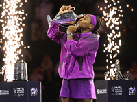 RIYADH, SAUDI ARABIA - NOVEMBER 09: Coco Gauff of the United States poses with the Billie Jean King Trophy after defeating Qinwen Zheng of C...