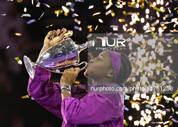 RIYADH, SAUDI ARABIA - NOVEMBER 09: Coco Gauff of the United States poses with the Billie Jean King Trophy after defeating Qinwen Zheng of C...