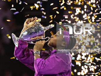 RIYADH, SAUDI ARABIA - NOVEMBER 09: Coco Gauff of the United States poses with the Billie Jean King Trophy after defeating Qinwen Zheng of C...