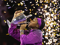 RIYADH, SAUDI ARABIA - NOVEMBER 09: Coco Gauff of the United States poses with the Billie Jean King Trophy after defeating Qinwen Zheng of C...