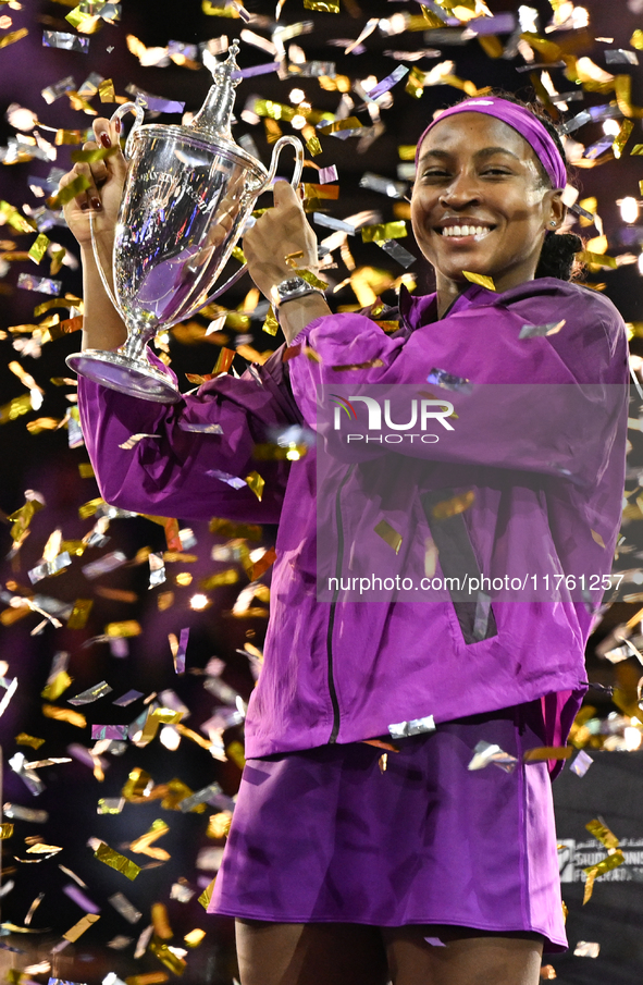 RIYADH, SAUDI ARABIA - NOVEMBER 09: Coco Gauff of the United States poses with the Billie Jean King Trophy after defeating Qinwen Zheng of C...