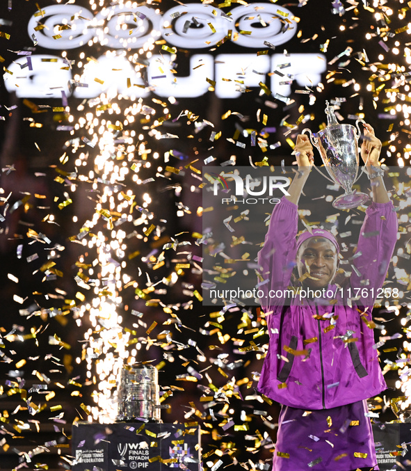 RIYADH, SAUDI ARABIA - NOVEMBER 09: Coco Gauff of the United States poses with the Billie Jean King Trophy after defeating Qinwen Zheng of C...