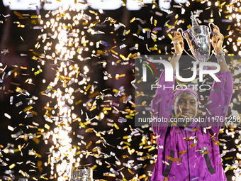 RIYADH, SAUDI ARABIA - NOVEMBER 09: Coco Gauff of the United States poses with the Billie Jean King Trophy after defeating Qinwen Zheng of C...