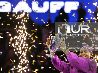 RIYADH, SAUDI ARABIA - NOVEMBER 09: Coco Gauff of the United States poses with the Billie Jean King Trophy after defeating Qinwen Zheng of C...