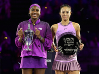 RIYADH, SAUDI ARABIA - NOVEMBER 09: Coco Gauff of the United States and Qinwen Zheng of China pose at the Awards Ceremony during the Singles...