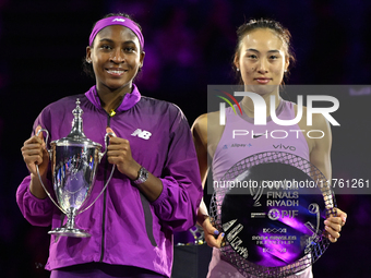 RIYADH, SAUDI ARABIA - NOVEMBER 09: Coco Gauff of the United States and Qinwen Zheng of China pose at the Awards Ceremony during the Singles...