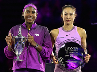 RIYADH, SAUDI ARABIA - NOVEMBER 09: Coco Gauff of the United States and Qinwen Zheng of China pose at the Awards Ceremony during the Singles...