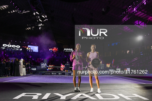 RIYADH, SAUDI ARABIA - NOVEMBER 09: Coco Gauff of the United States and Qinwen Zheng of China pose at the Awards Ceremony during the Singles...