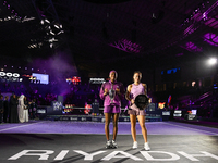 RIYADH, SAUDI ARABIA - NOVEMBER 09: Coco Gauff of the United States and Qinwen Zheng of China pose at the Awards Ceremony during the Singles...