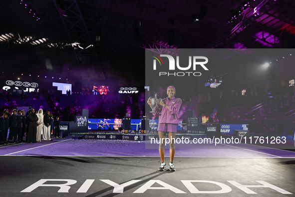 RIYADH, SAUDI ARABIA - NOVEMBER 09: Coco Gauff of the United States poses with the Billie Jean King Trophy after defeating Qinwen Zheng of C...