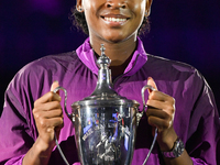 RIYADH, SAUDI ARABIA - NOVEMBER 09: Coco Gauff of the United States poses with the Billie Jean King Trophy after defeating Qinwen Zheng of C...