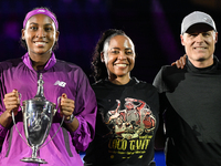 RIYADH, SAUDI ARABIA - NOVEMBER 09: Coco Gauff of the United States poses with her mother Candi Gauff and coach Matt Daly, after defeating Q...