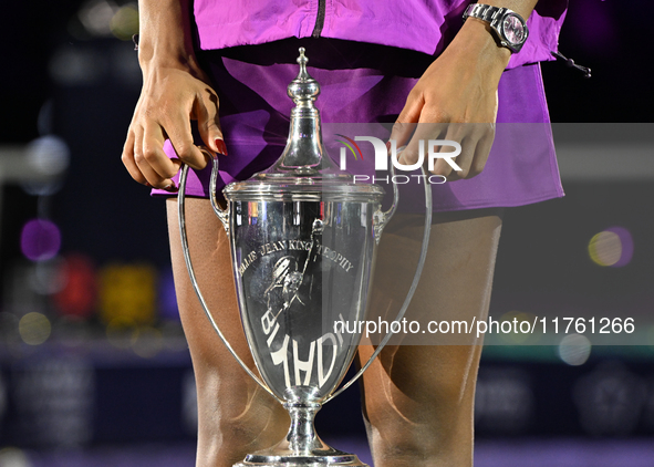 RIYADH, SAUDI ARABIA - NOVEMBER 09: Coco Gauff of the United States holds the Billie Jean King Trophy after defeating Qinwen Zheng of China...