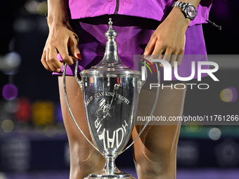 RIYADH, SAUDI ARABIA - NOVEMBER 09: Coco Gauff of the United States holds the Billie Jean King Trophy after defeating Qinwen Zheng of China...