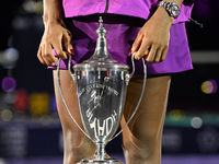 RIYADH, SAUDI ARABIA - NOVEMBER 09: Coco Gauff of the United States holds the Billie Jean King Trophy after defeating Qinwen Zheng of China...