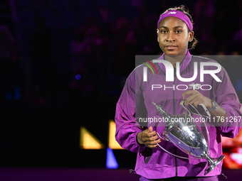 RIYADH, SAUDI ARABIA - NOVEMBER 09: Coco Gauff of the United States carries with the Billie Jean King Trophy after defeating Qinwen Zheng of...