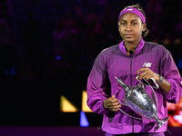 RIYADH, SAUDI ARABIA - NOVEMBER 09: Coco Gauff of the United States carries with the Billie Jean King Trophy after defeating Qinwen Zheng of...