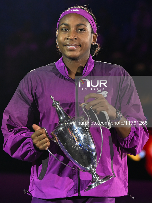 RIYADH, SAUDI ARABIA - NOVEMBER 09: Coco Gauff of the United States carries with the Billie Jean King Trophy after defeating Qinwen Zheng of...